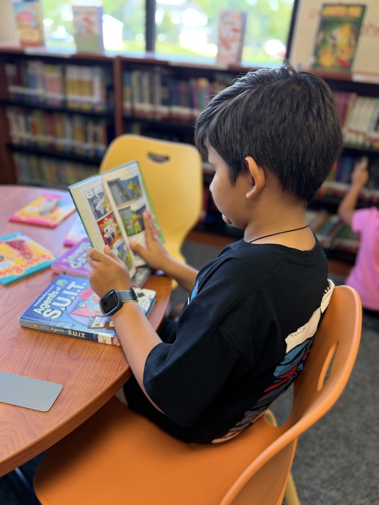 Boy reading book.