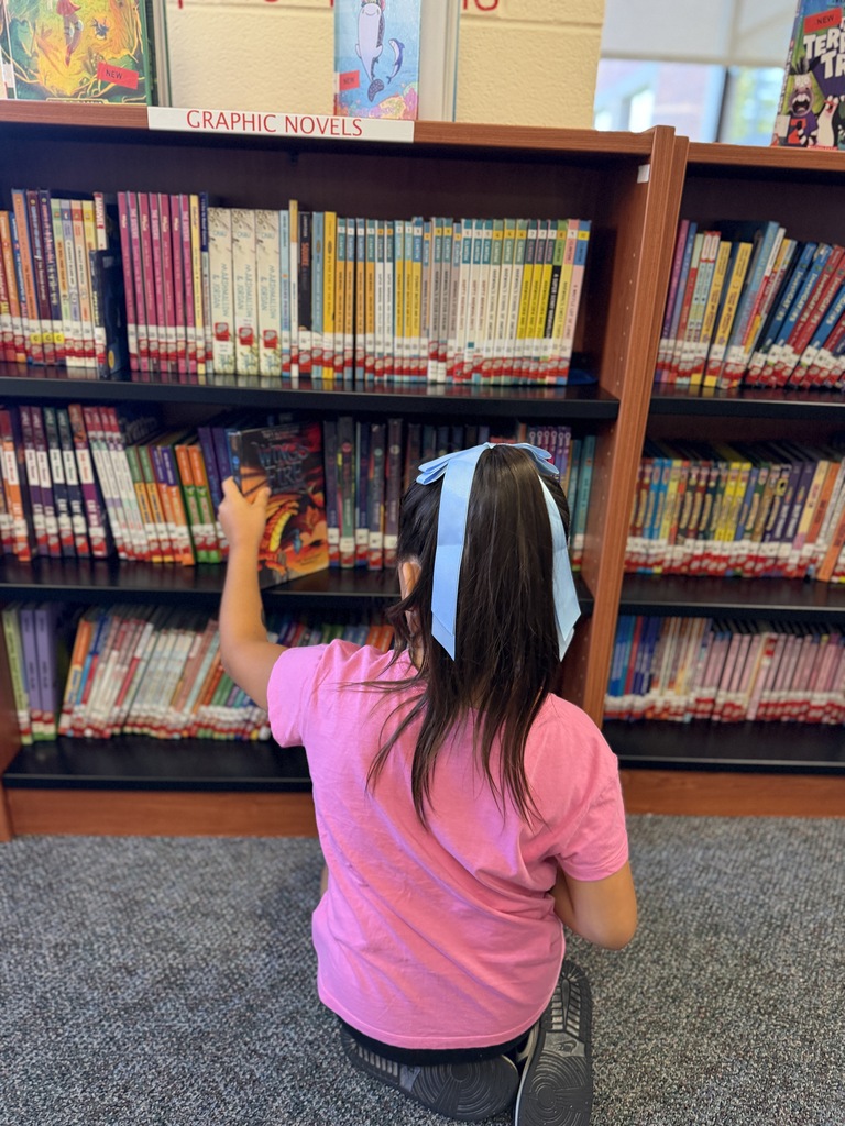 Girl checking out books.