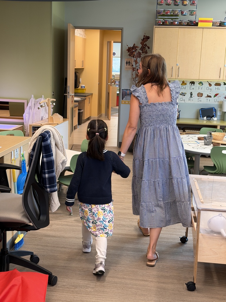 Teacher walks with student.