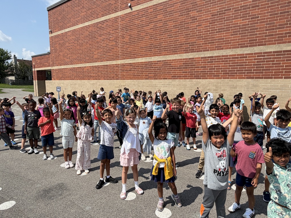 TES students raising their arms up.