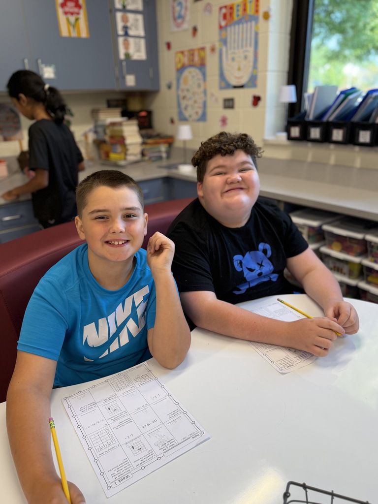 2 boys working on math.