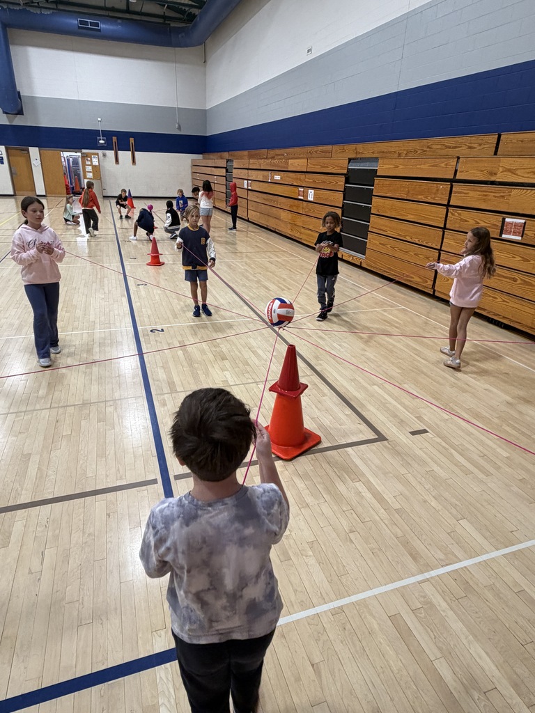 Students moving the string together to get the ball.