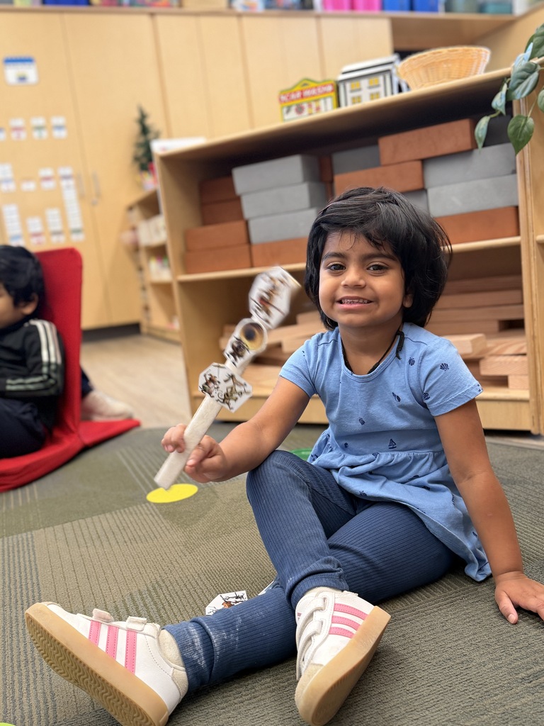 STudent holds up retelling story stick.