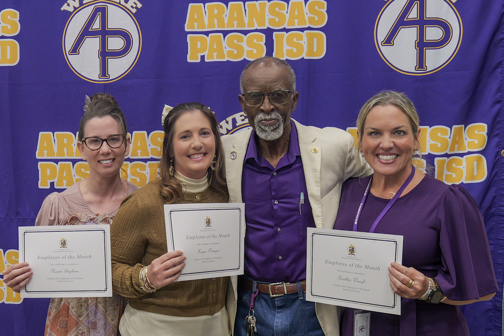 Staff members receiving an award