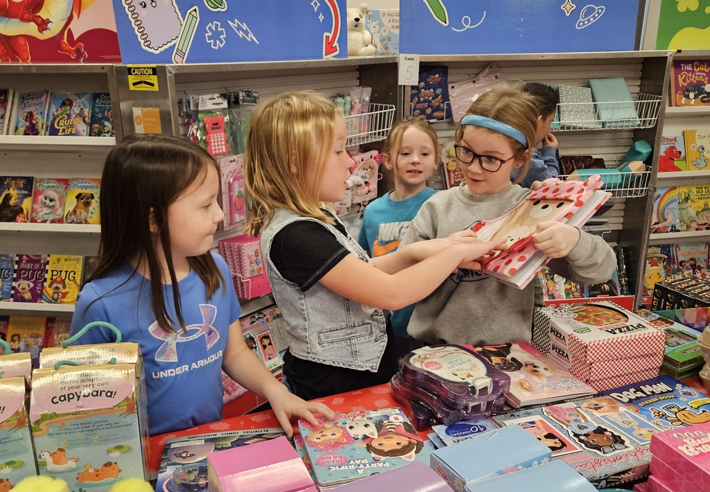 Students looking at books