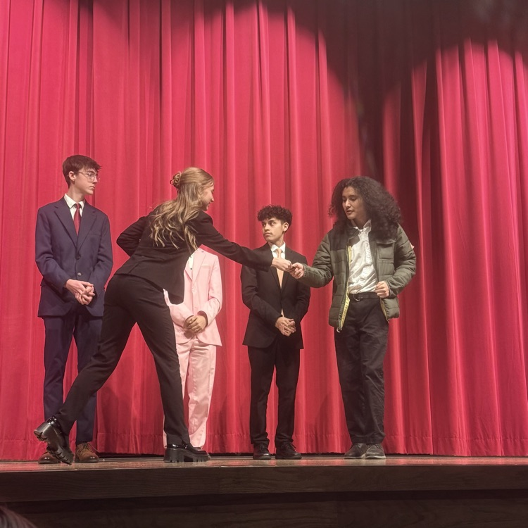 student getting award on stage