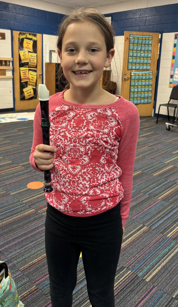 student holding recorder