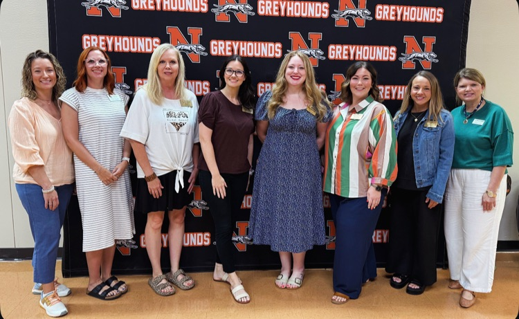 Literacy support teachers taking a picture at Newport elementary as they prepare to assist in administering DIBELS. 