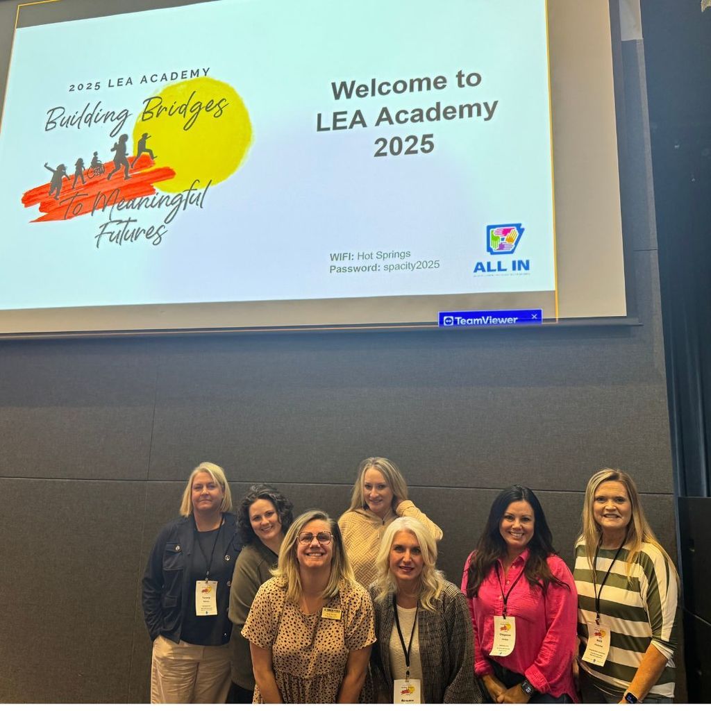 A group of educators posing as a team.