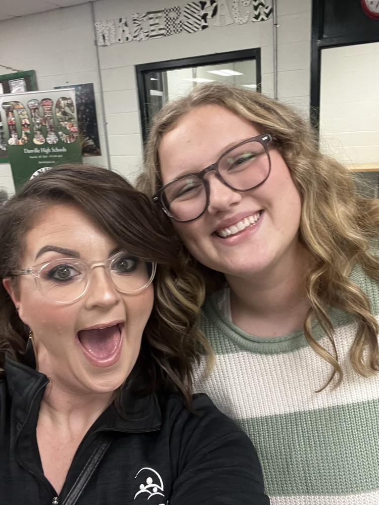teacher and student smiling together