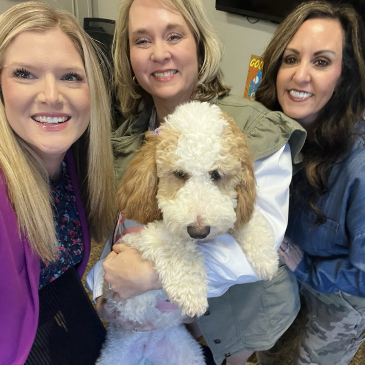 professional educators, who facilitated the training posed facing forward with emotional support dog.