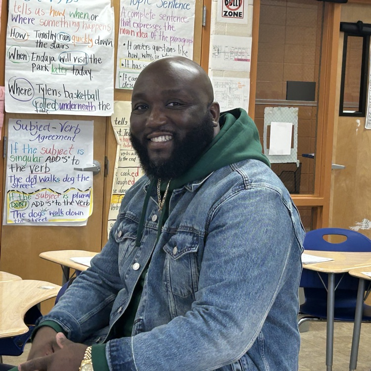 Principal sitting coaching another teacher  