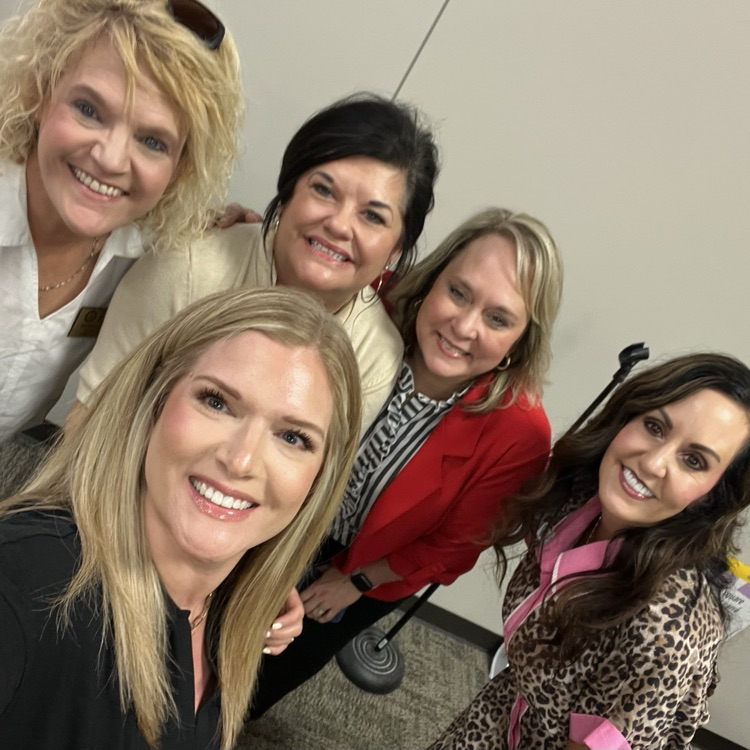 Early childhood leaders and partners smiling together during the regional meeting at Arch Ford.