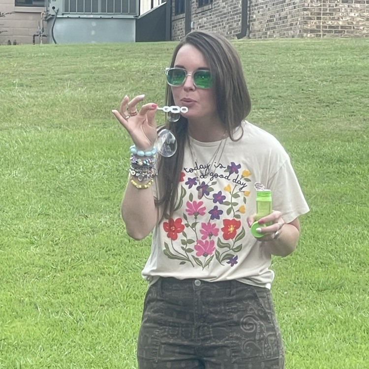 teacher blowing bubbles 