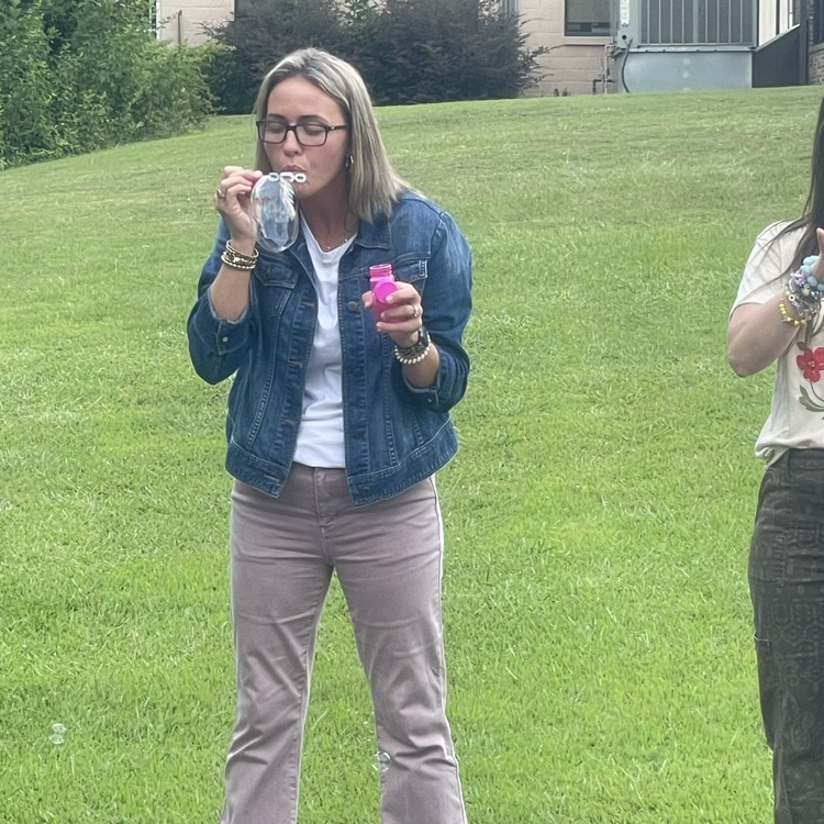 teacher playing bubbles 