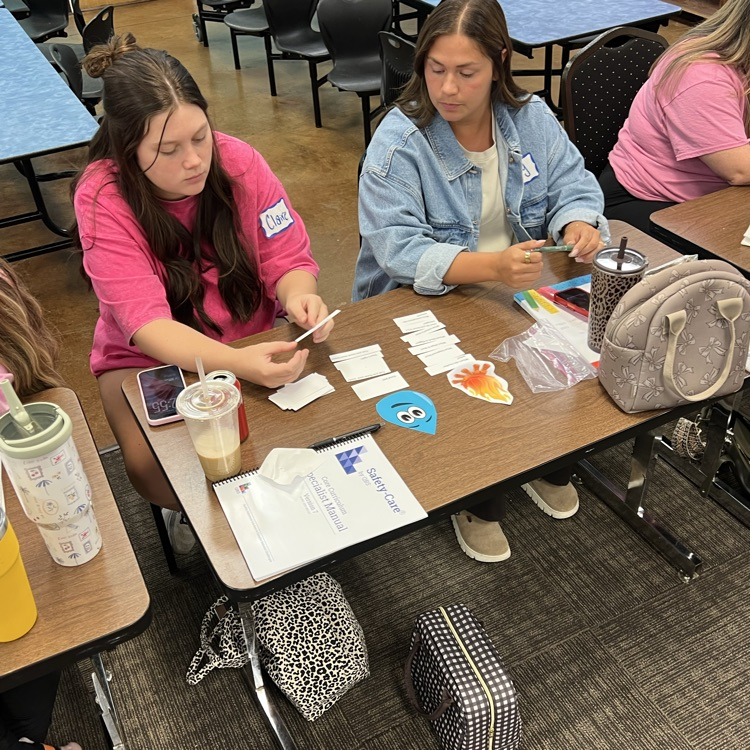     Educators participate in a hands on professional development activity focused on early childhood learning.
