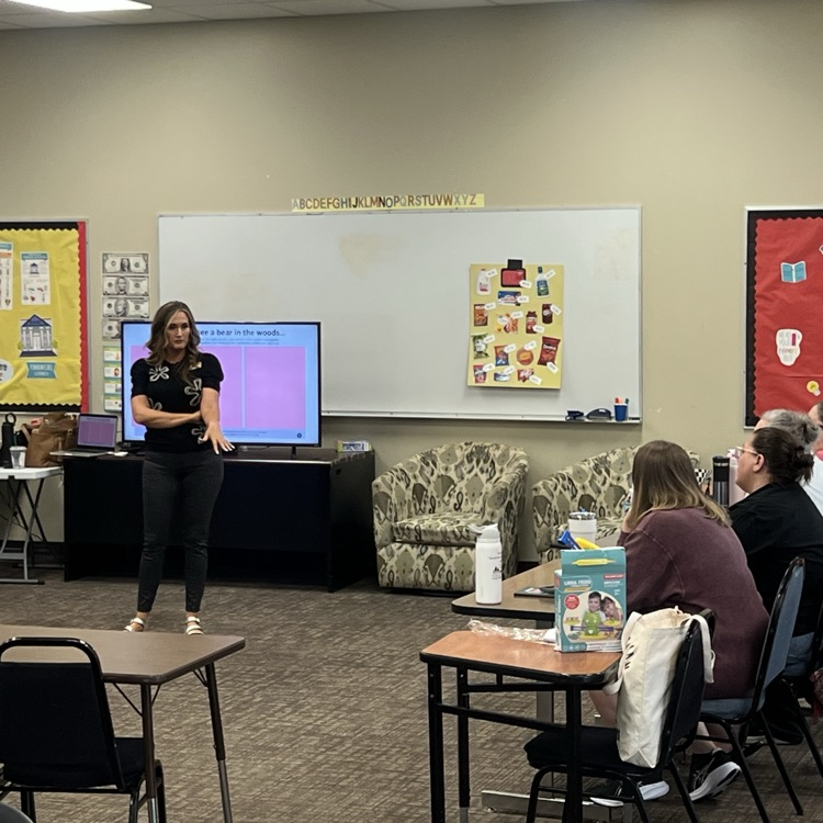     An Early Childhood Team member leads professional development for educators in a classroom.