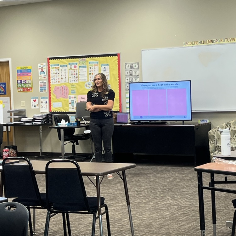     An Early Childhood Team member leads professional development for educators in a classroom.