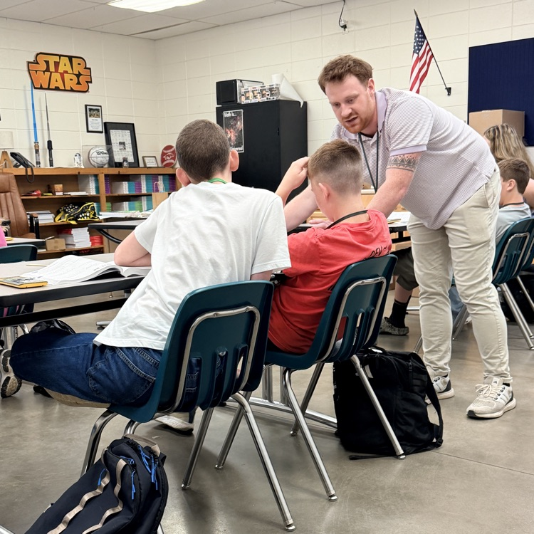 teacher working with students 