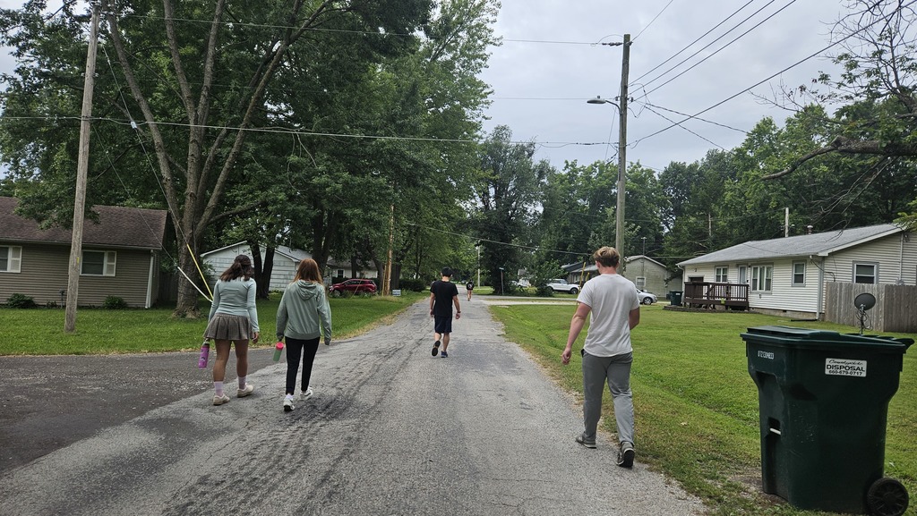 students walking through the neib
