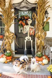 Skeleton and Halloween decor on doorway.