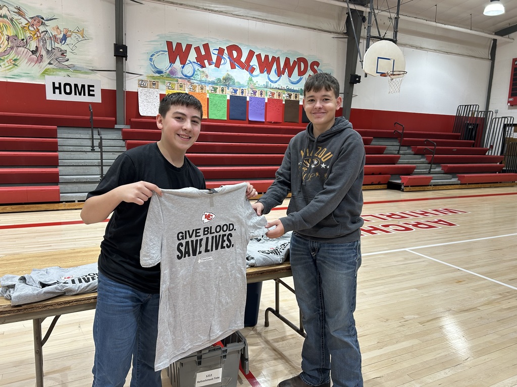 Giving a donor their tshirt.