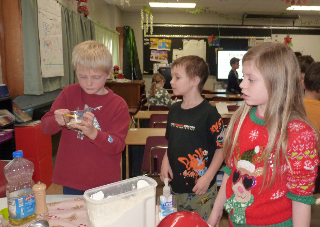 2nd graders mix up cookie dough.