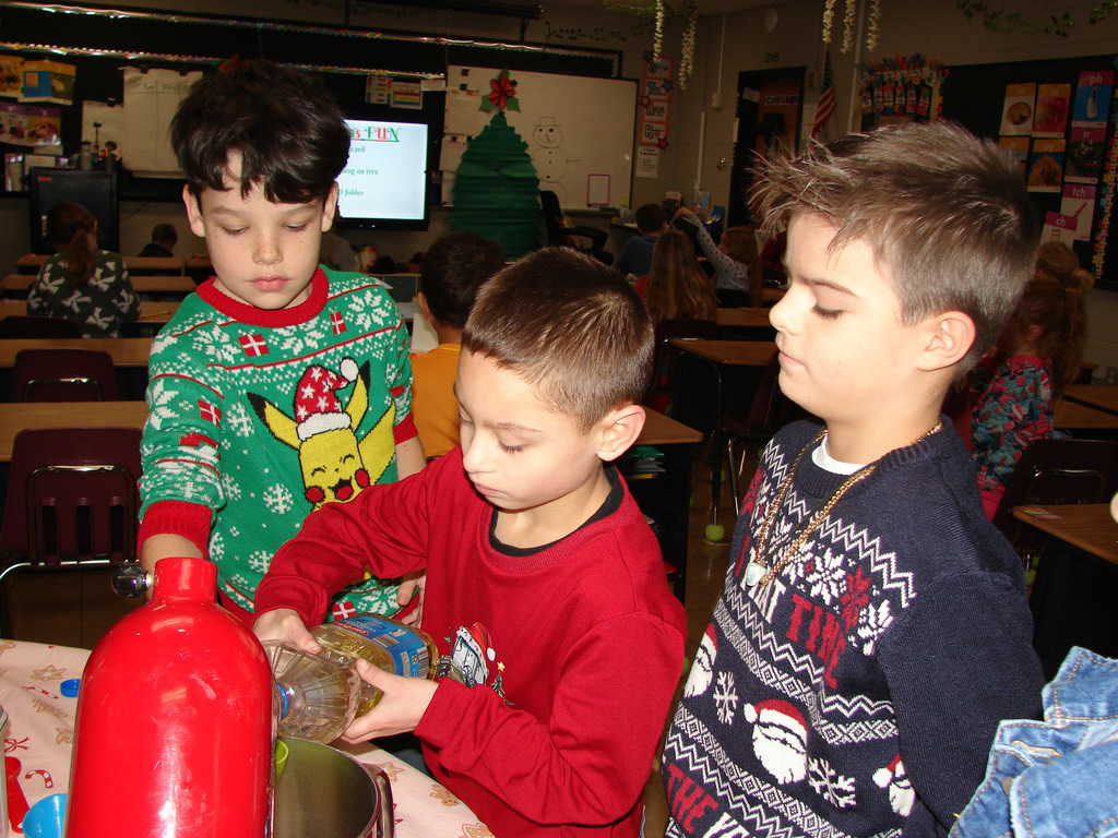 2nd graders mix up cookie dough.