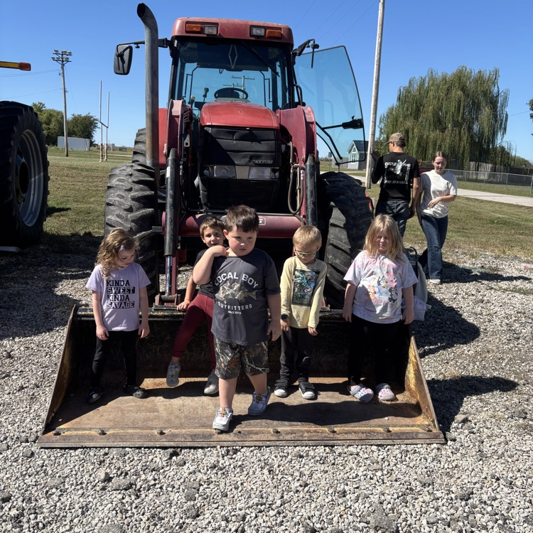 kids in a tractor bucket 