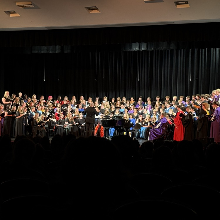 9/10th grade honor choir performing at their concert under the direction of Dr. Jordan Cox