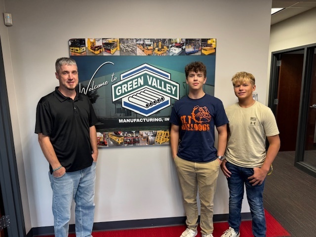 Luke and his supervisor and coworker at Green Valley Manufacturing.