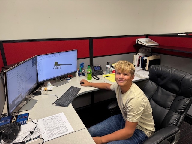Luke at his job at Green Valley Manufacturing.