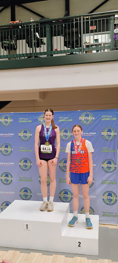 Emelyn Roberts on the 2nd place podium for high jump at the Illinois 2A Indoor Track & Field Finals.