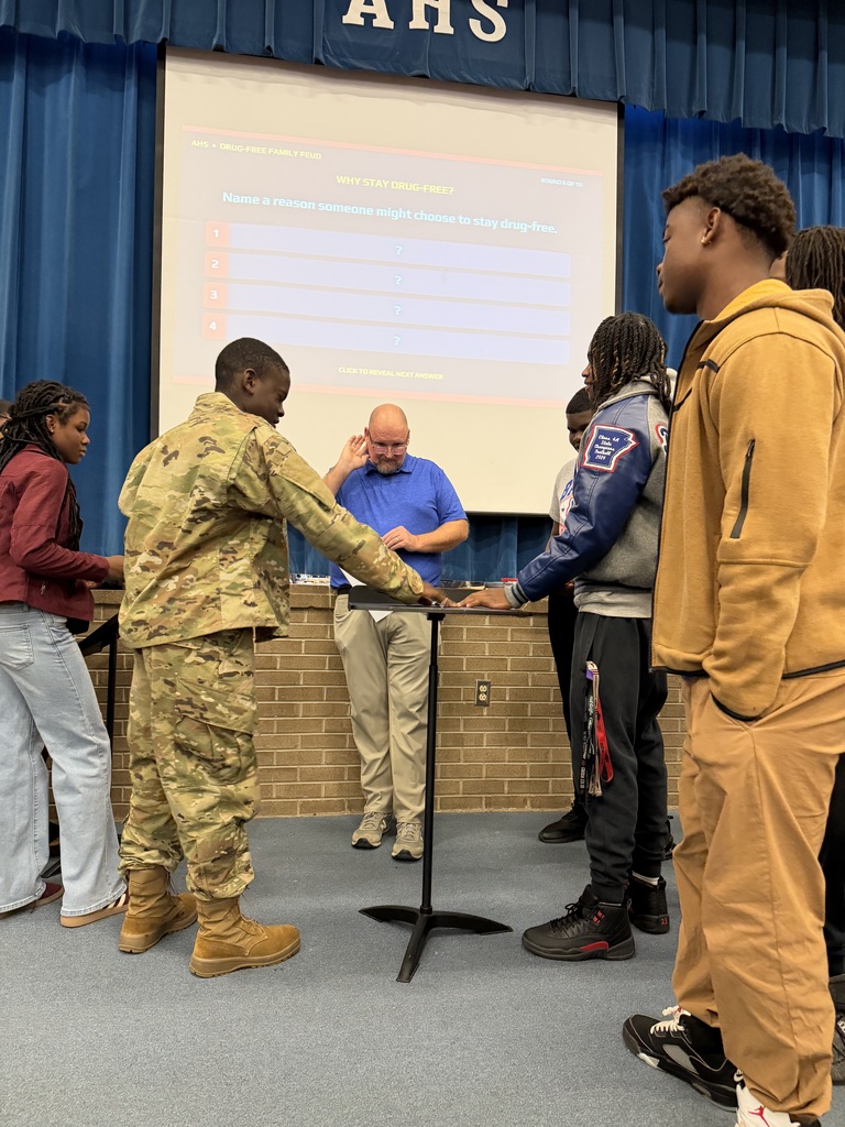 Students complete in a Family Feud-style game.