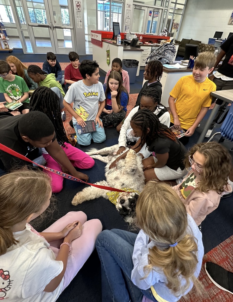 Goza Middle School Media Specialist Kathy King invited a special visitor to the library today. Ranger, a Portuguese Water Dog, is a certified therapy dog through Pet Partners. Students got to know Ranger and even read The Dot by Peter H. Reynolds to him. It was a wonderful experience for all. Ranger and his owner Kathlee Danley live in Hot Springs. We are so glad they came today! #BadgerPride