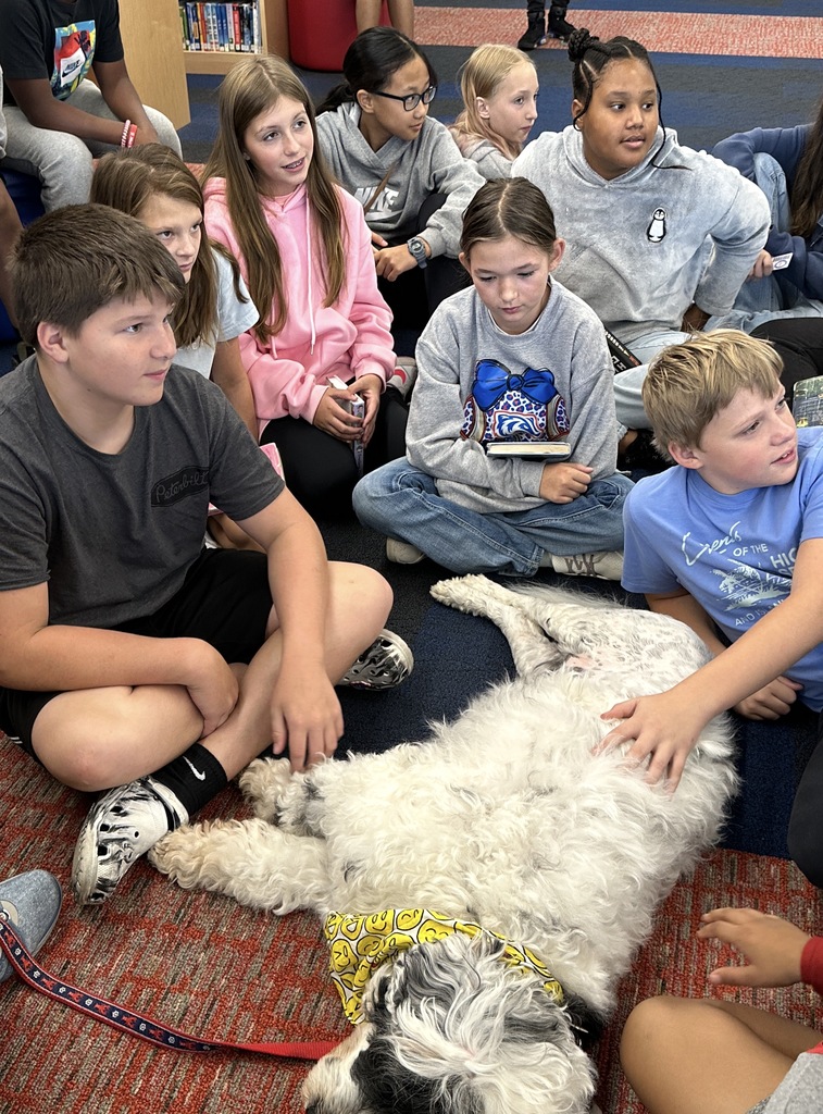 Goza Middle School Media Specialist Kathy King invited a special visitor to the library today. Ranger, a Portuguese Water Dog, is a certified therapy dog through Pet Partners. Students got to know Ranger and even read The Dot by Peter H. Reynolds to him. It was a wonderful experience for all. Ranger and his owner Kathlee Danley live in Hot Springs. We are so glad they came today! #BadgerPride