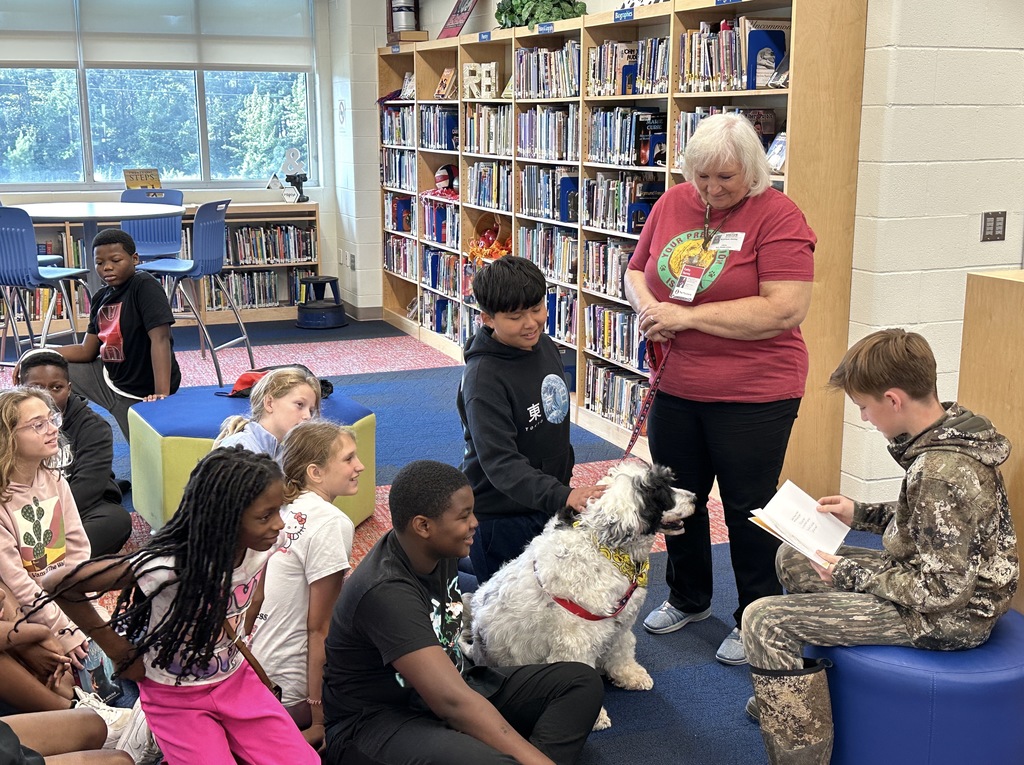 Goza Middle School Media Specialist Kathy King invited a special visitor to the library today. Ranger, a Portuguese Water Dog, is a certified therapy dog through Pet Partners. Students got to know Ranger and even read The Dot by Peter H. Reynolds to him. It was a wonderful experience for all. Ranger and his owner Kathlee Danley live in Hot Springs. We are so glad they came today! #BadgerPride