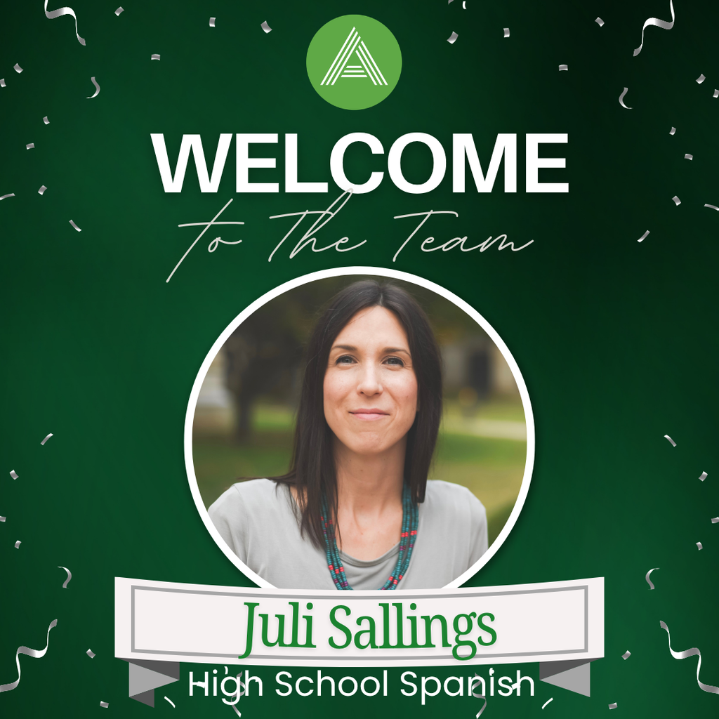 A welcome graphic on a dark green background with silver confetti and the Arkansas Arts Academy logo at the top. Large white text reads "WELCOME" with "to The Team" in a handwritten script beneath it. Centered is a circular portrait of Juli Sallings, who has shoulder-length dark hair and is smiling while wearing a light gray top and a turquoise beaded necklace. A banner below the photo displays her name, "Juli Sallings," in green text, with "High School Spanish" written underneath in white.