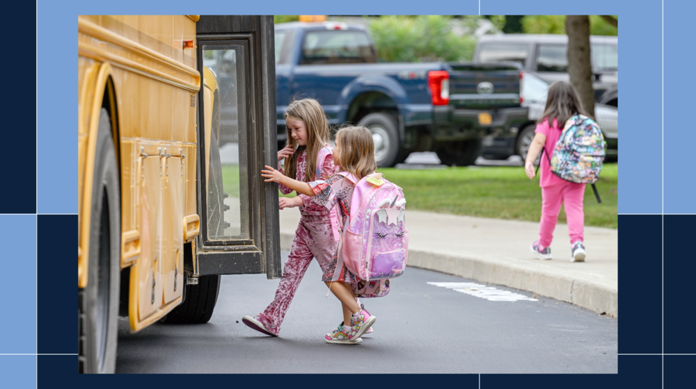 students getting on the bus