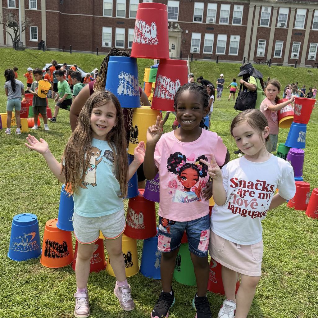 Kindergarten with a cup stacking challenge at field day