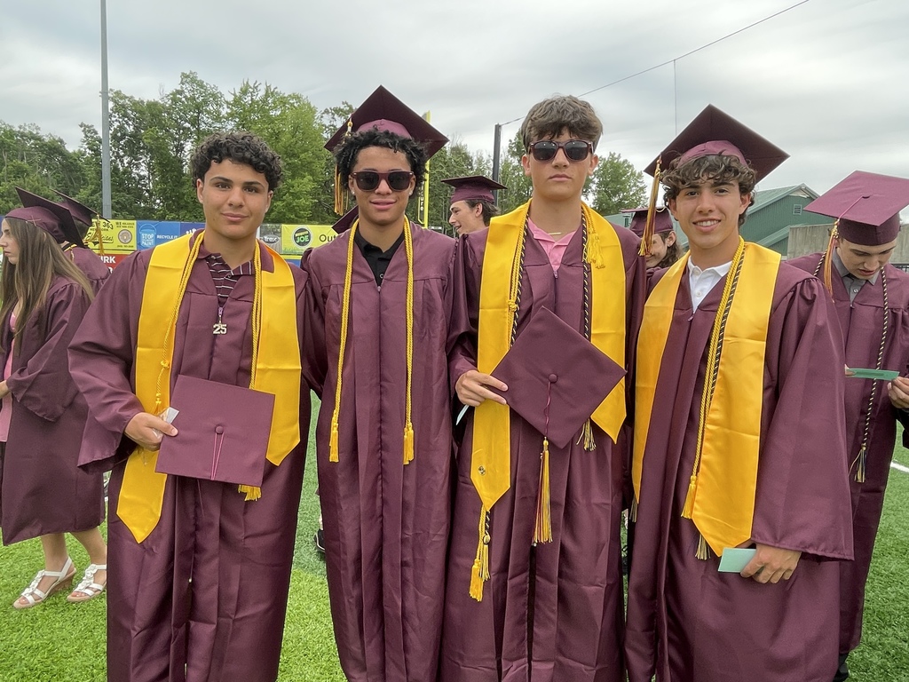 4 Arlington high school students at their graduation ceremony