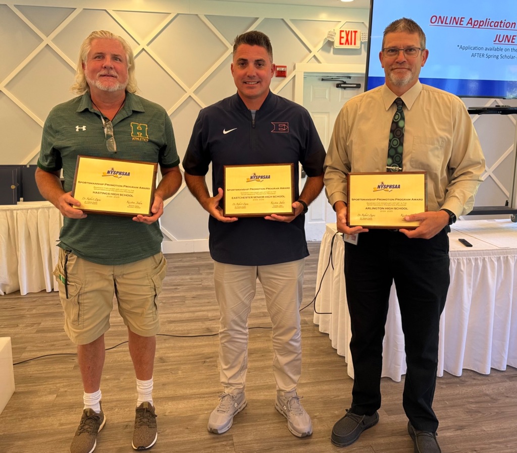 Recipients of the NYSPHSAA Sportsmanship Promotion Banner Award. Arlington's Mike Cring on R.