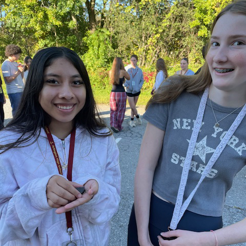 Students holding the Blanding's turtle hatchling.
