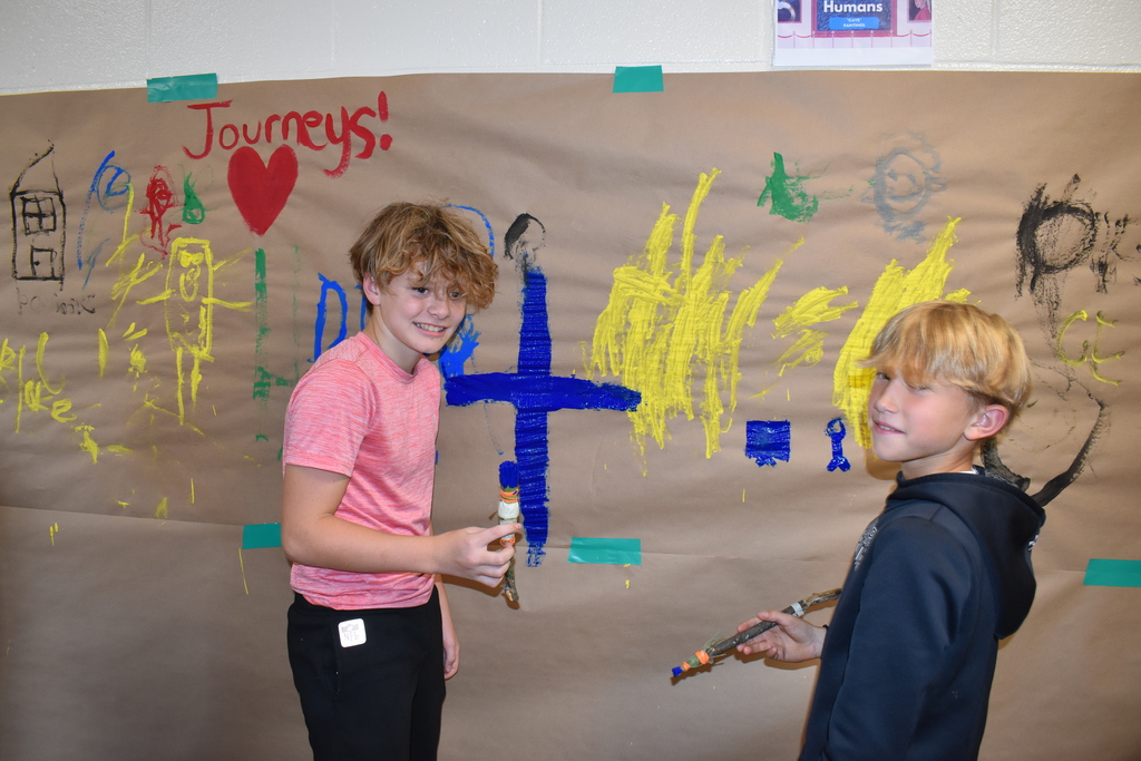 6th graders creating a "cave painting" 