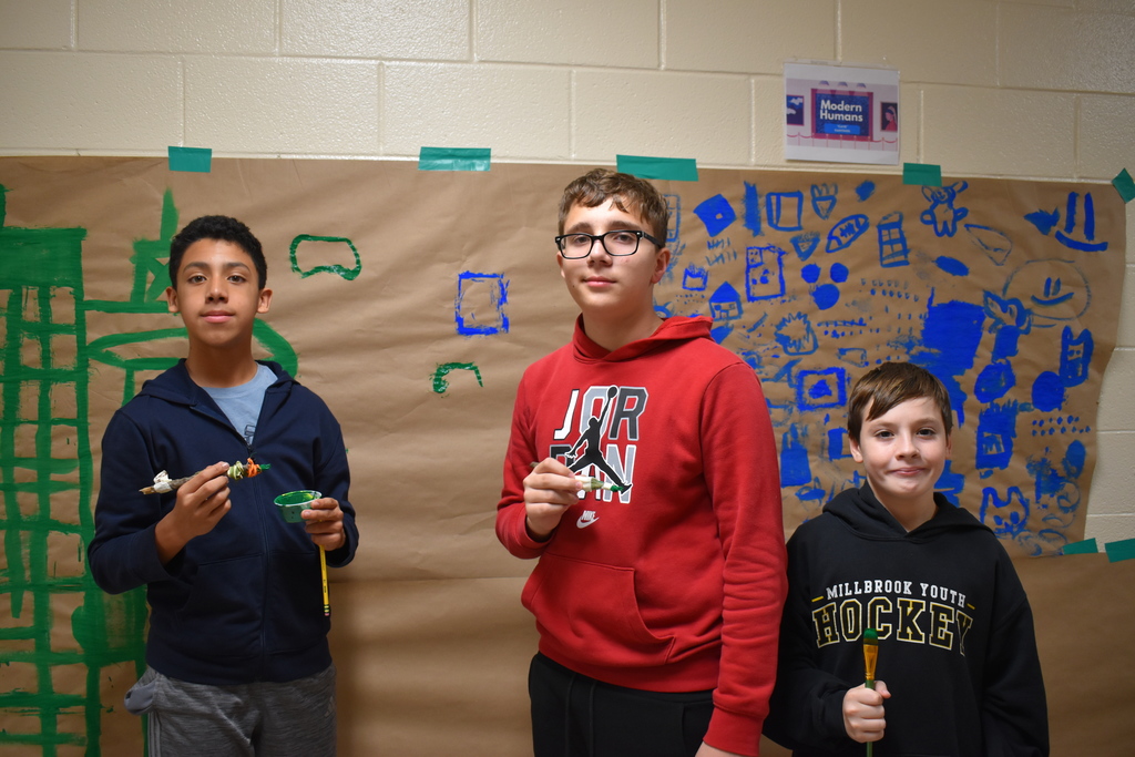 6th graders creating a "cave painting" 