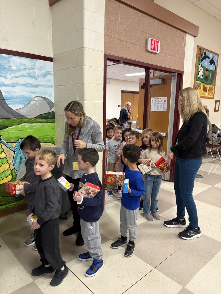 Students bringing donations to the cafeteria