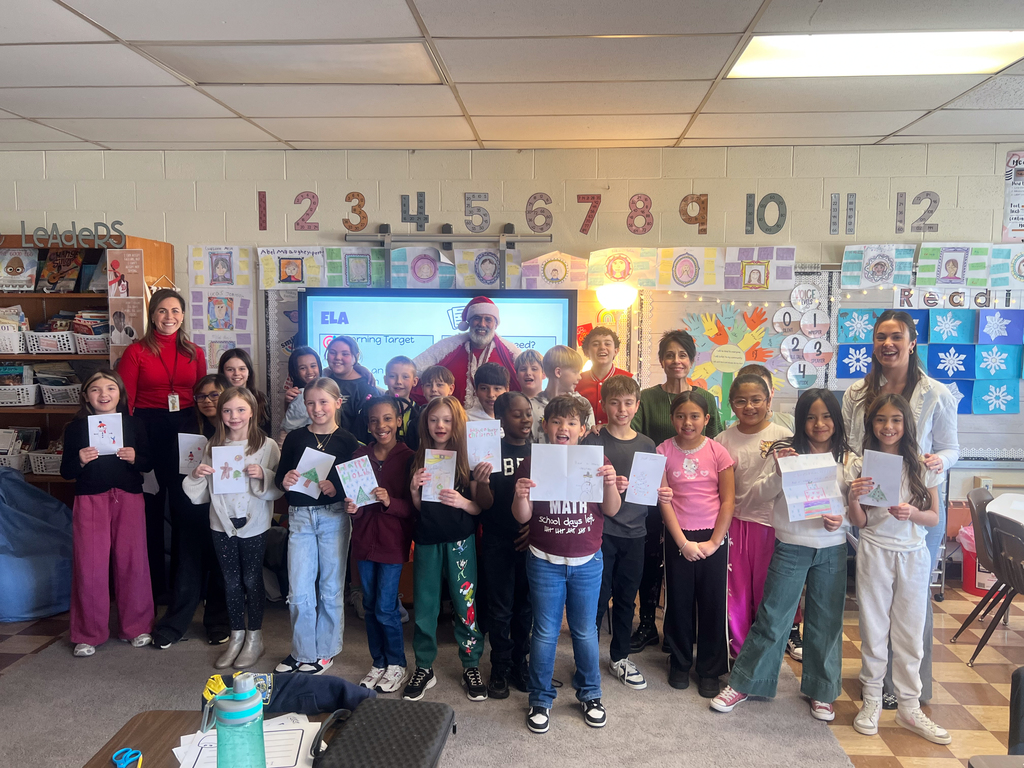 West Rd Students with their cards and Santa Joe