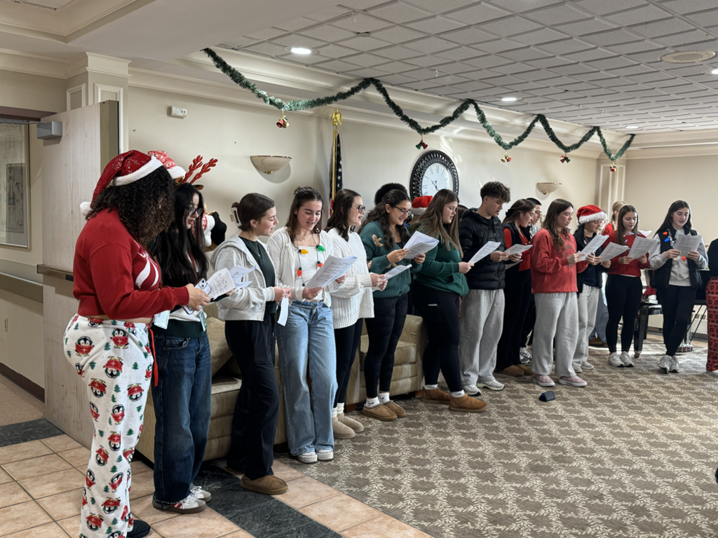 AHS Italian and Spanish Clubs bring holiday cheer to the Lutheran Care Center
