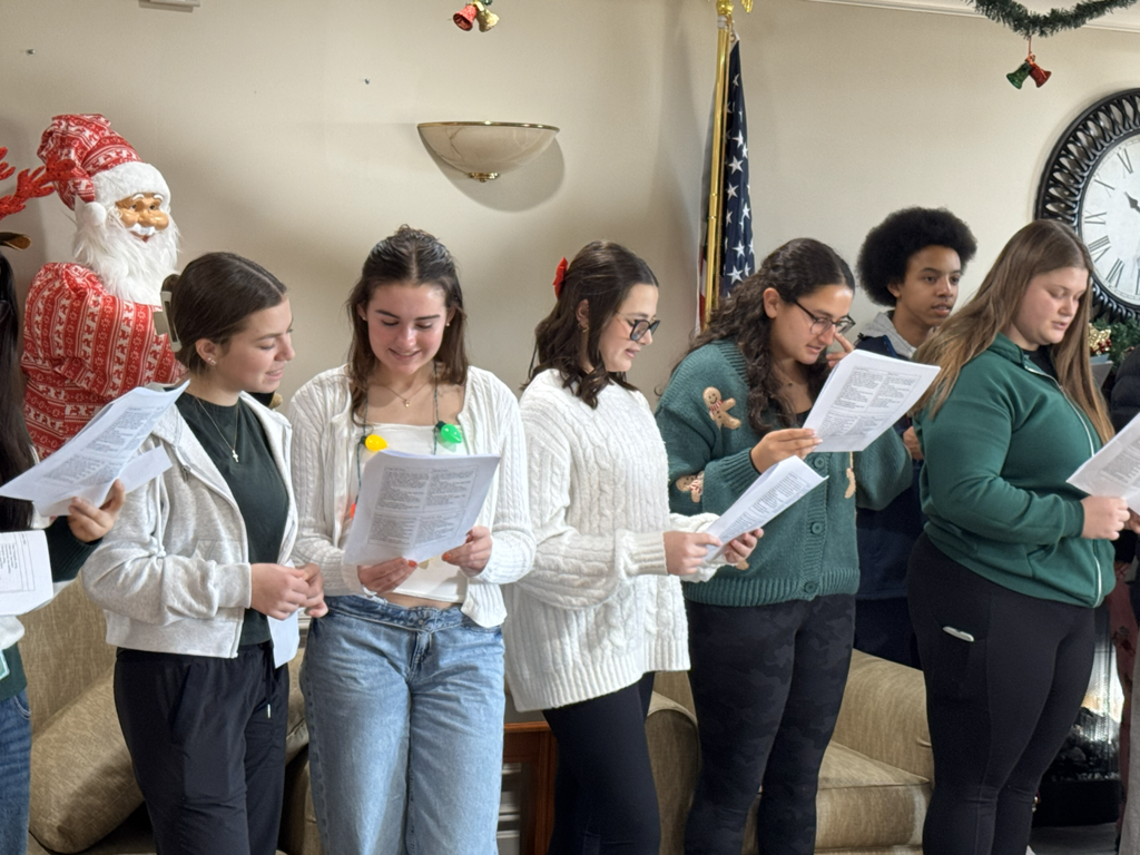 AHS Italian and Spanish Clubs bring holiday cheer to the Lutheran Care Center