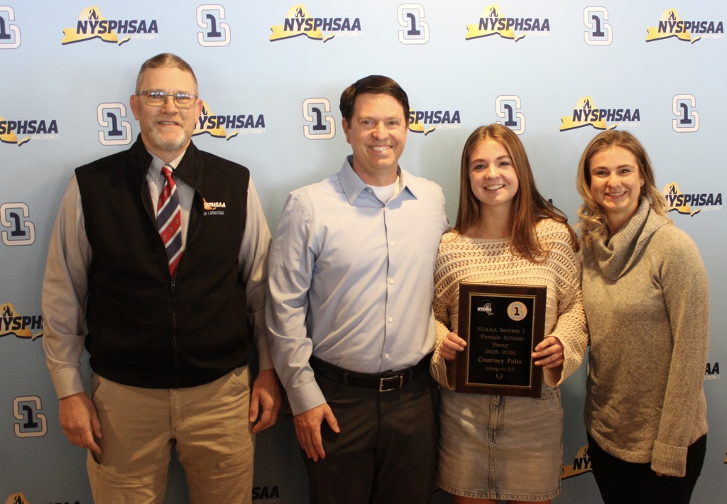 Courtney Foltz with her family and Arlington Athletic Director Mike Cring